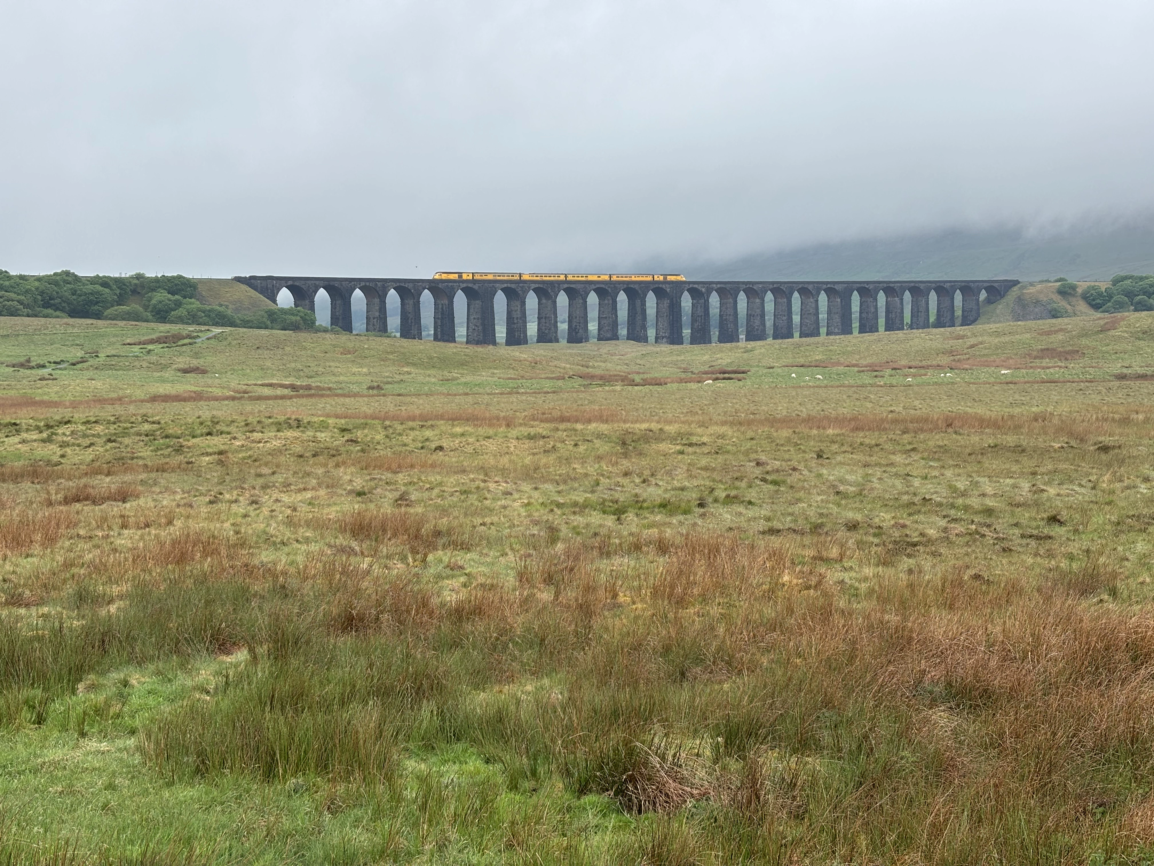 A steam train crossing the Ribblehead Viaduct